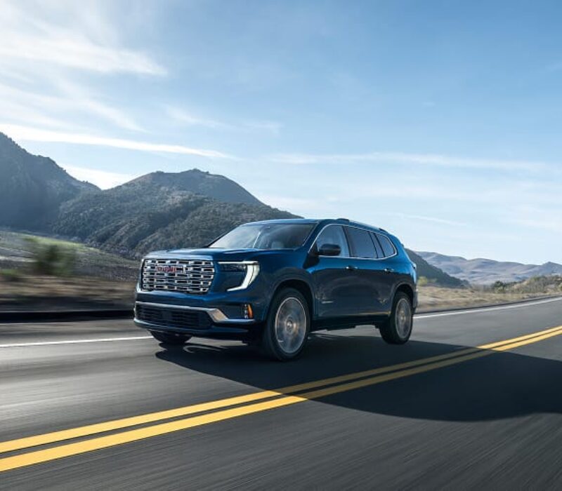 gmc car driving on the road